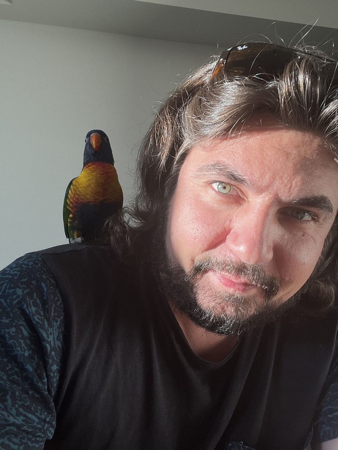 Scheklein Oleksandr with a parrot on his shoulder