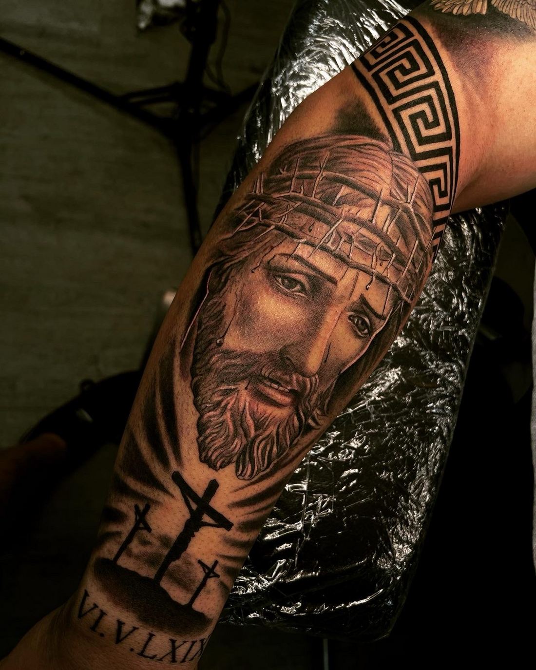 Black and grey Jesus portrait tattoo