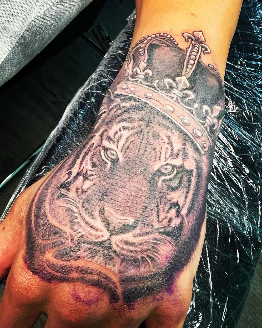 Black and grey crowned tiger tattoo