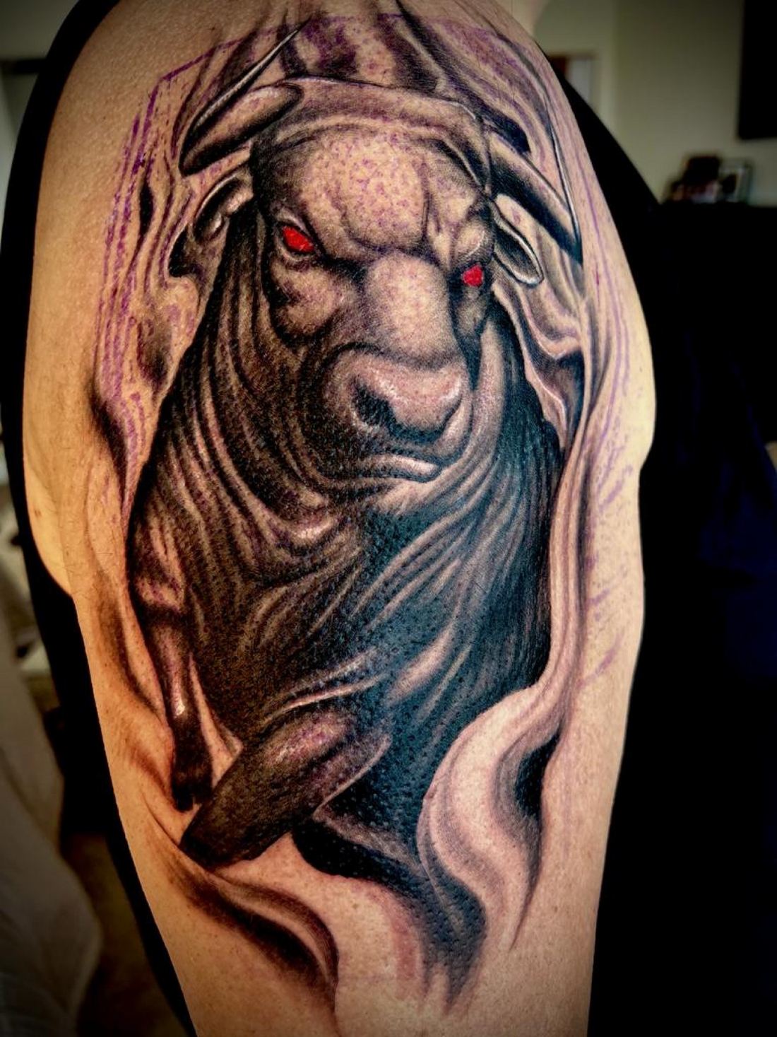 Tattoo: Black & grey — Bull with red eyes